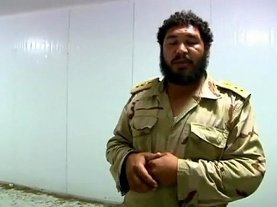 Gaddfi body removed for burial