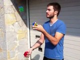 A man juggles and solves Rubiks Cubes