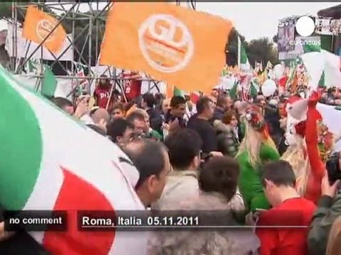 Berlusconi targeted by topless protesters - no comment