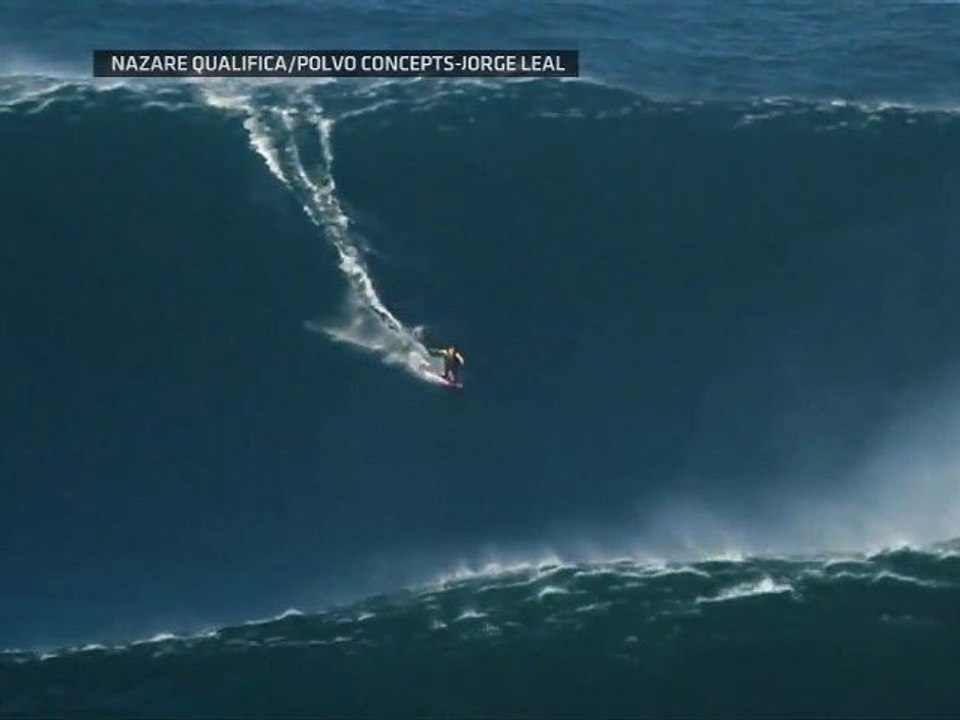Surfer rides 90 foot wave (World Record)