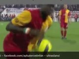 Emmanuel Eboue tries to avoid  lighters, coins and stones