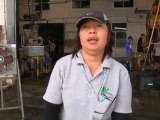 Thai workers assess flood damage as waters recede