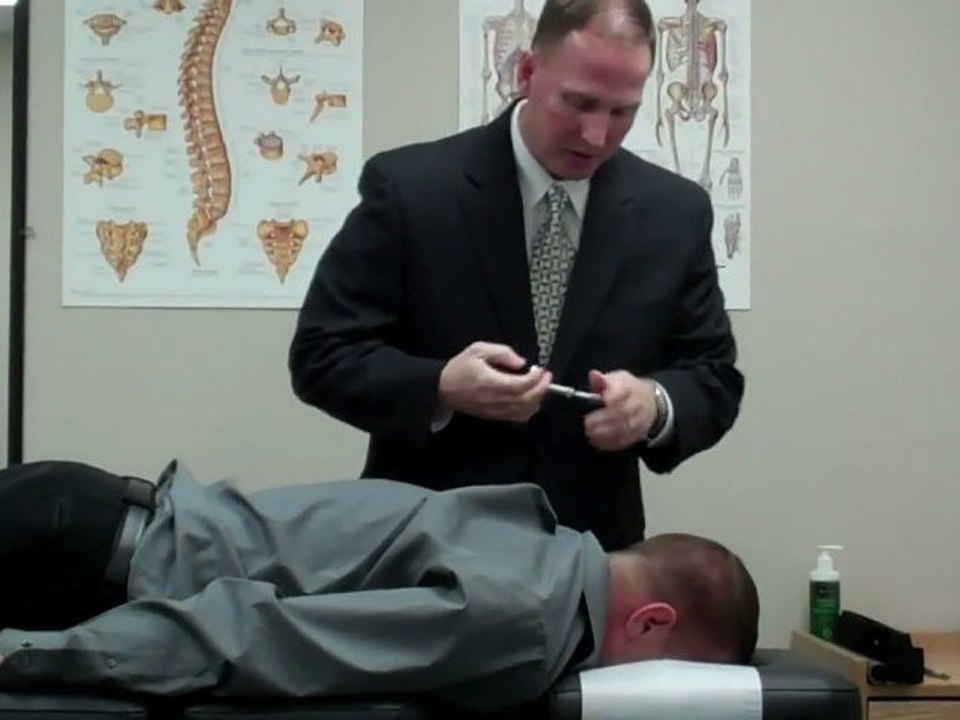 Bloomington IL Chiropractor performs Activator Technique adjustments