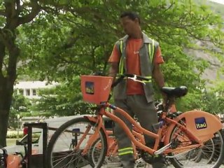Rio's residents go green with new orange bikes