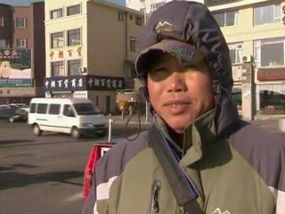 North Koreans mourn death of Kim in China