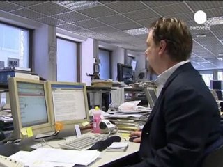 Italy short-term debt costs halve