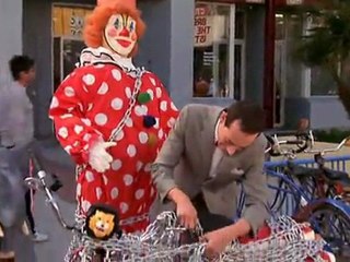 Pee-wee Herman locking his bike