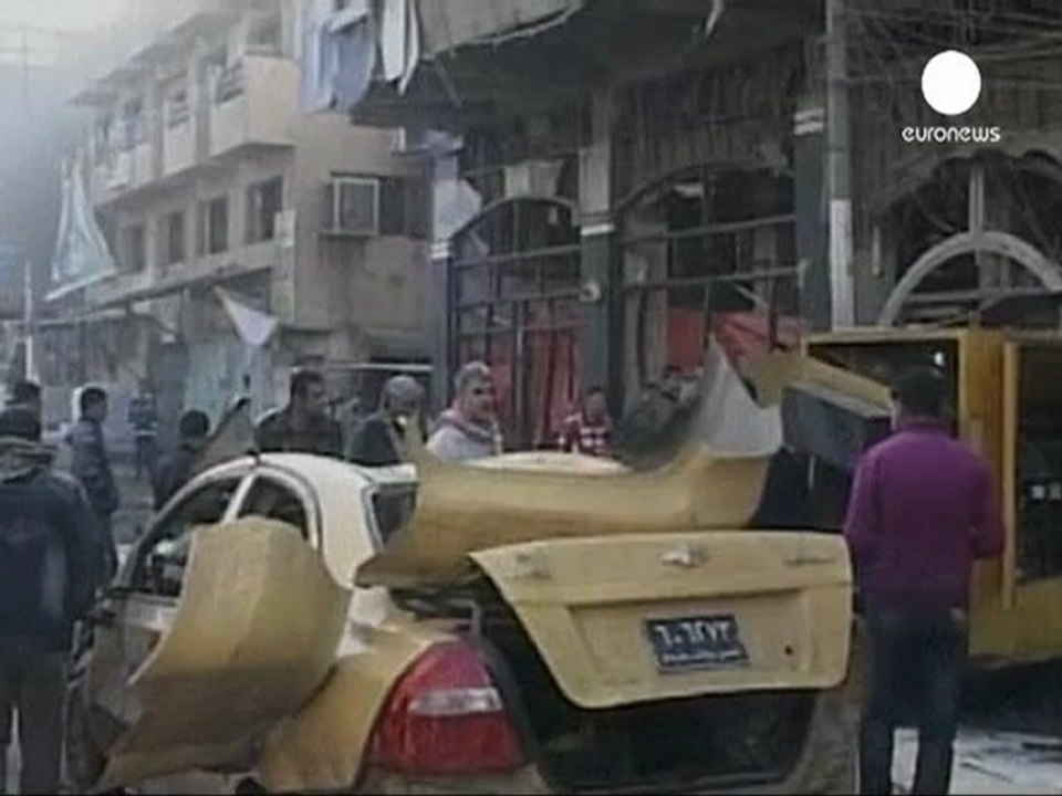 Iraq's army parades as rocket fire hits Green Zone