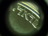 x60 zoom on 10 Agorot coin surface using mobile phone microscope