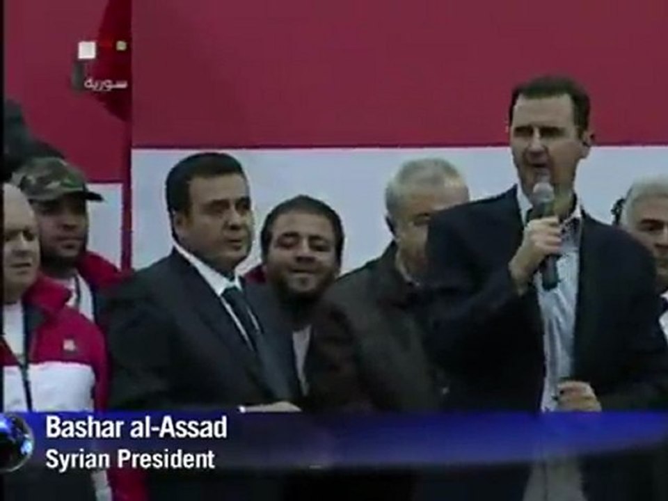 Assad takes defiant message to Damascus street
