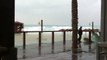 אנגליתעבריתערבית  Caramel Coast storm, waves crashing on the breakwater