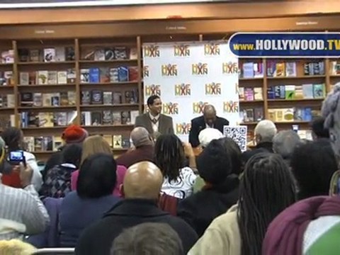 Bill Cosby and Braxton A. Cosby greet their fans