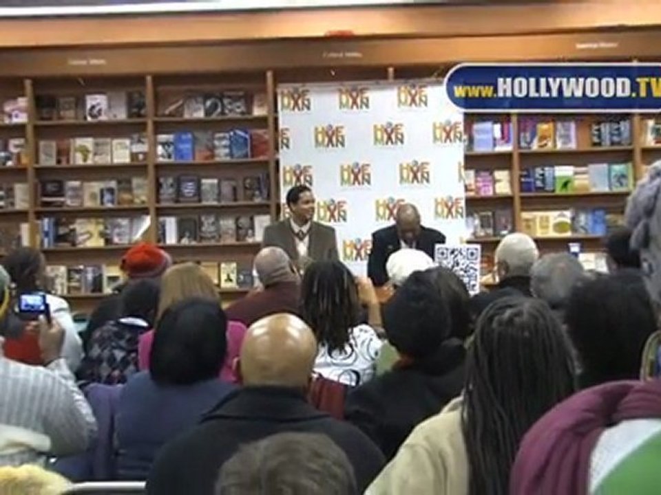 Bill Cosby and Braxton A. Cosby greet their fans