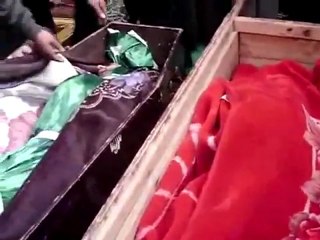 فري برس   حمص باباعمرو ثلاثة شهداء من عائلة واحدة مروان الحلواني وزوجته سهيلة جنيد وطفلهما عبد الهادي الحلواني 12 12 2011