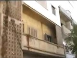 فري برس   باباعمرو احد البيوت المتعرضة للقصف والمحترق واصوات الرصاص تحيط بالحي 15 11 2011