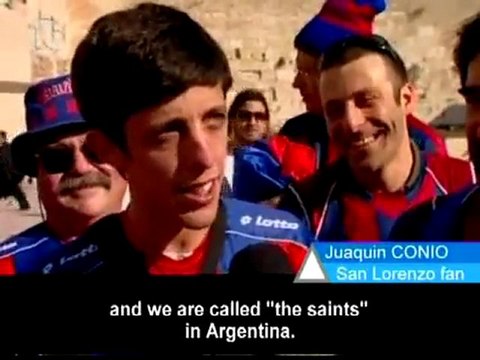 Israeli soccer fans solicit the Lord's help at the Wailing W