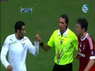 Andre Dias (Lazio) slugs Mark van Bommel (AC Milan) in the face