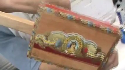 Team Unknown BBQ has a man with a Cigar Box Guitar