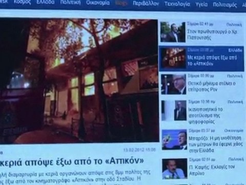 Athens smoulders after blazing protests over austerity