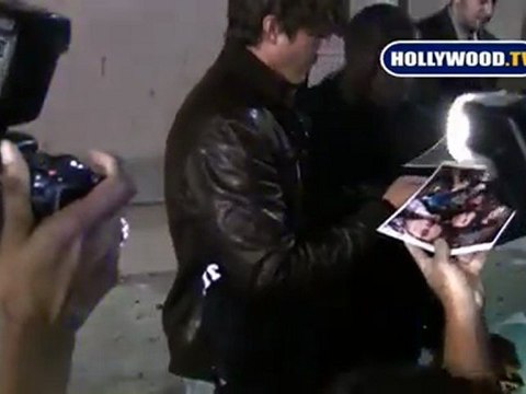 Ashton Kutcher Signs Autographs for Fans.