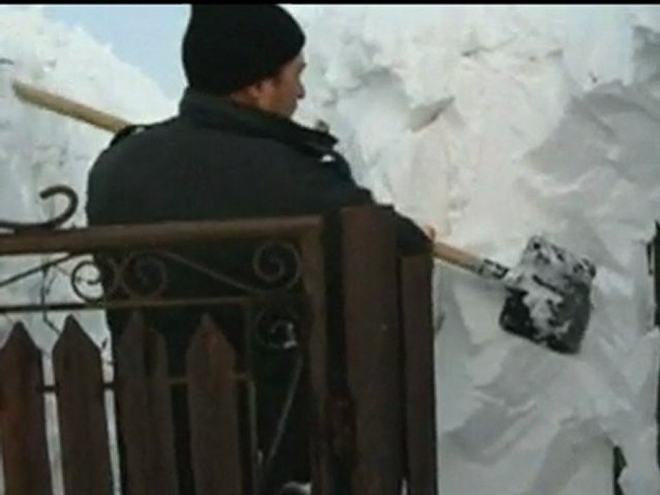 Man's house completely buried under snow in Romania