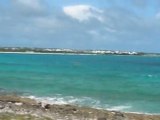 Cove bay in Anguilla and a distant view of Saint Martin (French side)