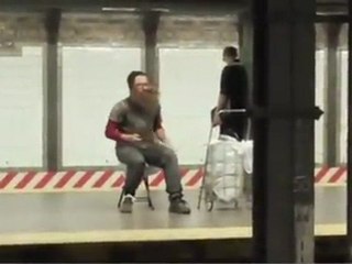 Homeless guy playing the drums