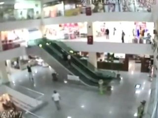 Man Saves Kid Falling Off Escalator