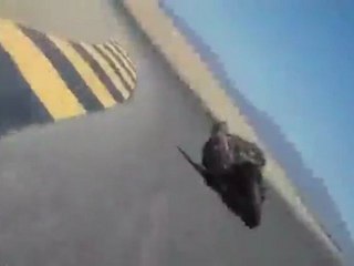 Biker Rubs Head on Asphalt