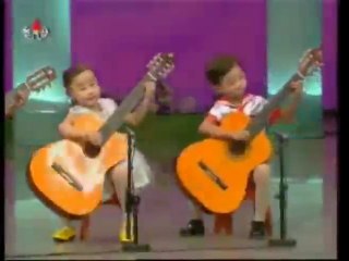 North Korean Children Playing The Guitar