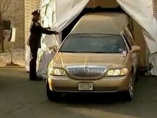 Houston coffin heads to funeral home after service.