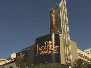 Houston items at auction, Lohan to return to TV