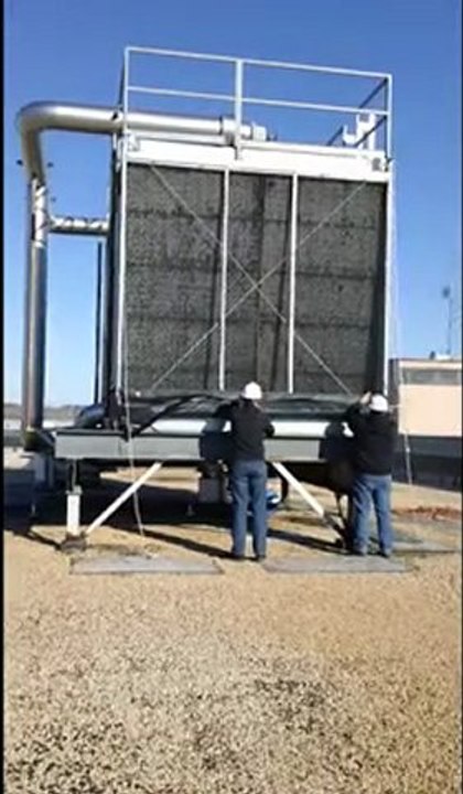 Pulley Mount Cottonwood Filter Screens -Two Men Lowering Filter on a Cooling Tower.