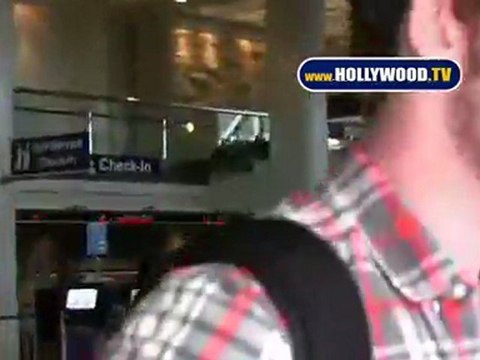 EXCLUSIVE - Miley Cyrus And Boyfriend Liam Hemsworth Spotted At LAX