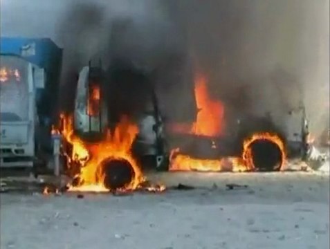 Afghan protesters set fire to NATO trucks.