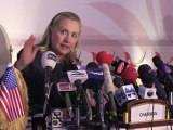 Clinton warns Assad of 'heavy cost' of crackdown