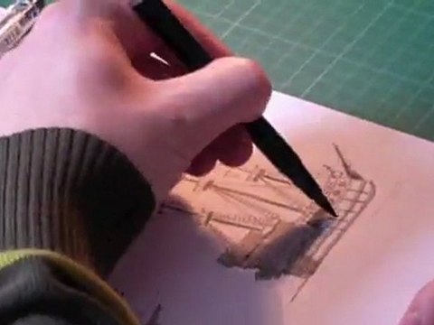 Brice Follet, artiste de bandes dessinées, dessine un croquis de bateau