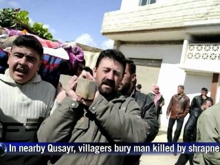 Syrians bury dead as Homs assault continues