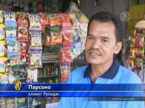 Потеряв руки, индонезийка стала фотографом