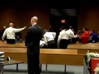 Two charged over courtroom brawl