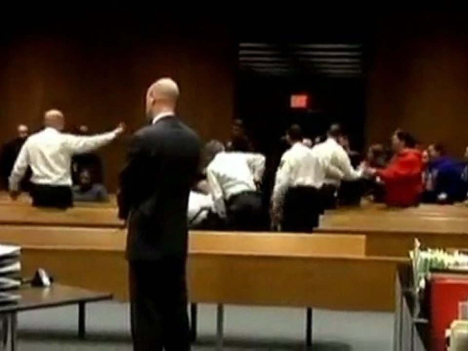 Two charged over courtroom brawl