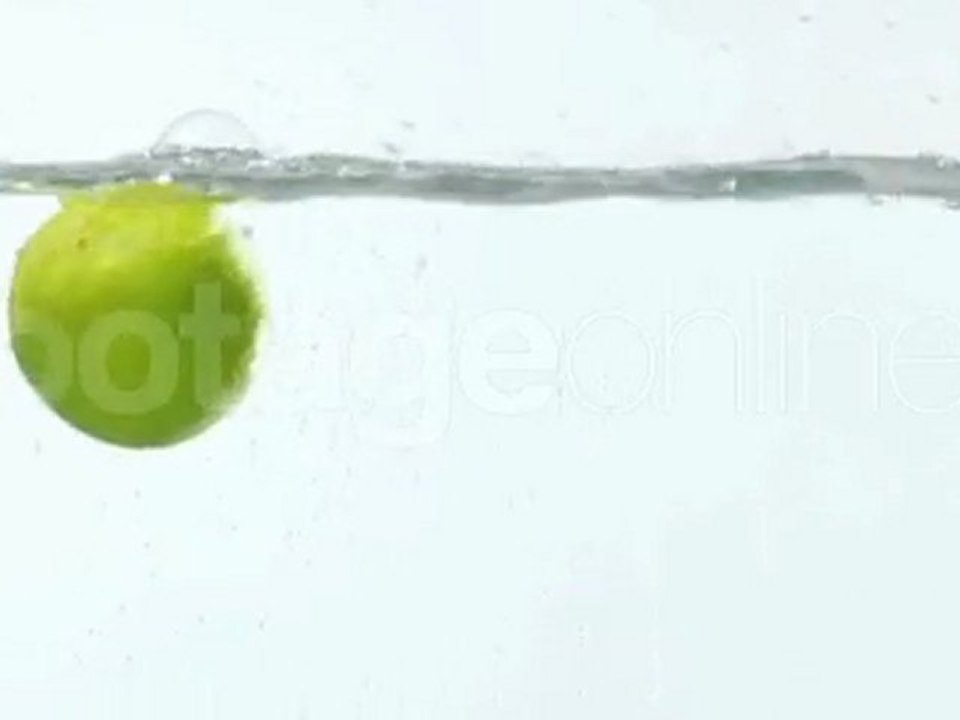 Limes falling into water footage_008052