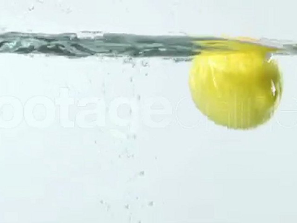 Lemon falls in water footage_008049