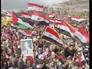 Pro-Assad rally marks revolt anniversary