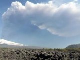 Plumes of black smoke erupt from Mount Etna