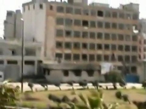 Burnt out cars litter Syrian streets