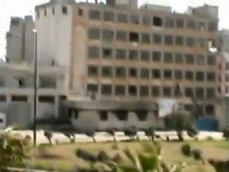 Burnt out cars litter Syrian streets