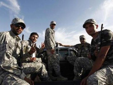 Libyan forces raid militia outposts