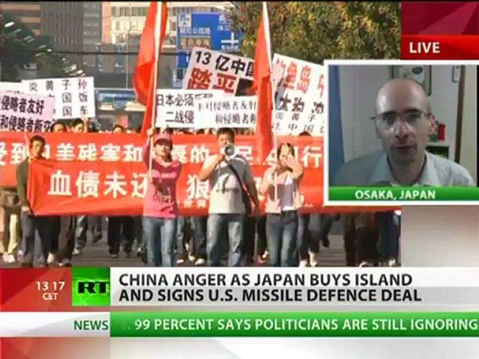 China anger as Japan buys island & signs US missile defence deal