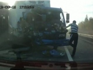 Russian trucker in amazing escape in head-on crash